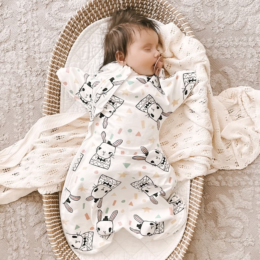 Gentle transition from swaddling to free arms without sacrificing sleep