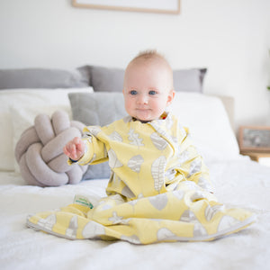 The Hands In & Out sleepsack for gentle swaddle transitioning, has a two-way zipper, top and bottom opening for easy diaper changes and a roomy, hip-friendly design, accommodates a hip-dysplasia brace.