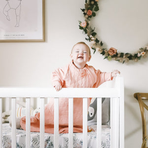 The Sleepy Hugs sleep sack for gentle swaddle transitioning, has a two way zipper top and bottom opening for easy diaper changes, the wide sack design is hip-friendly and fits a hip-dysplasia brace, helps startle reflex, perfect for tummy rollers.