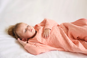 The Sleepy Hugs sleep sack for gentle swaddle transitioning, has a two way zipper top and bottom opening for easy diaper changes, the wide sack design is hip-friendly and fits a hip-dysplasia brace, helps startle reflex, perfect for tummy rollers.