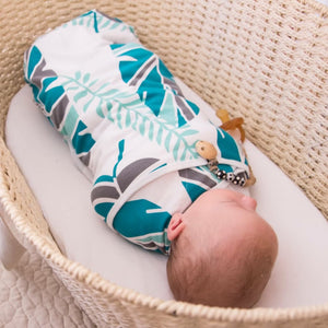 Koala Hugs newborn swaddle wraps to help calm the startle reflex for sleeping baby