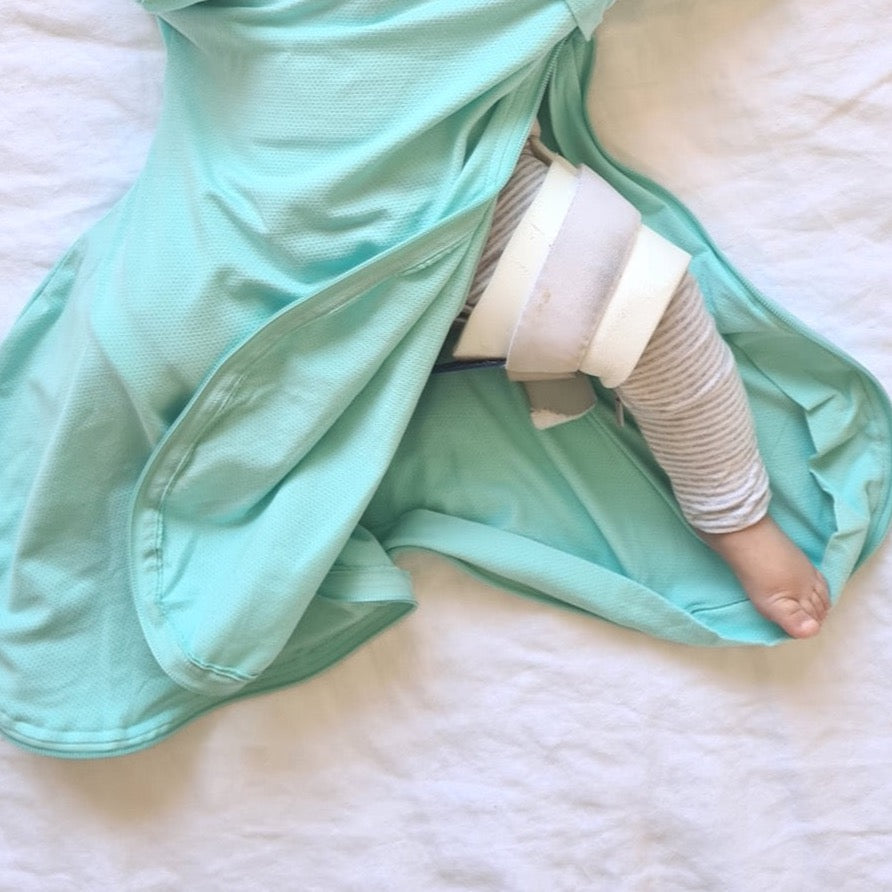 Baby sleep sack for babies wearing a hip harness due to hip dysplasia