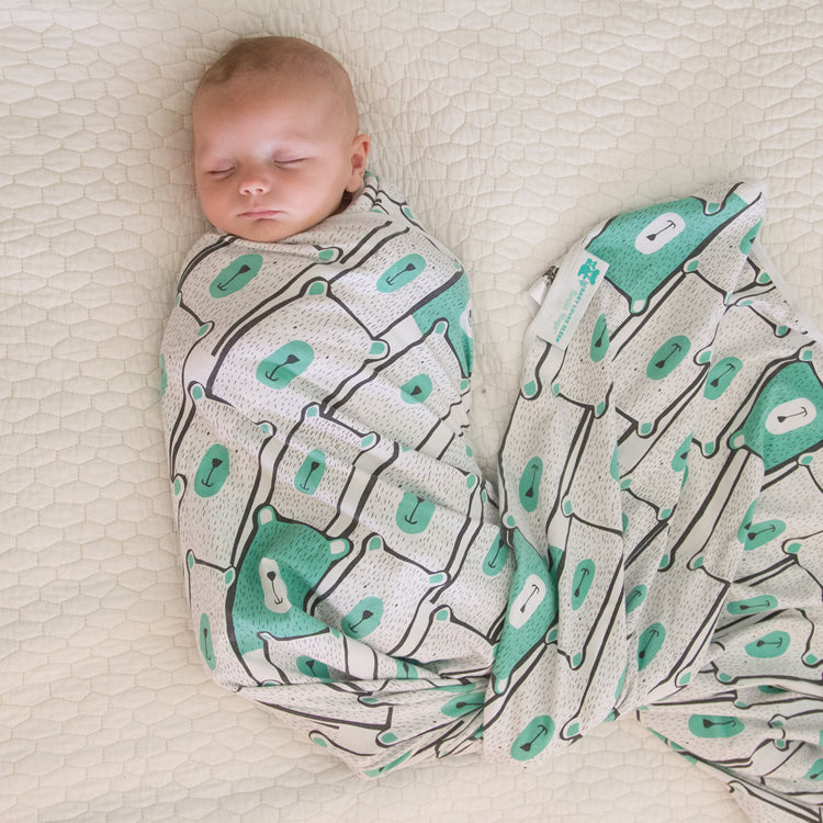 Newborn swaddle blanket for calming the startle reflex