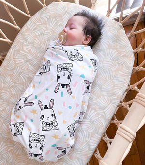 Koala Hugs newborn swaddle blanket with genius arm pockets to keep babies sleeping longer